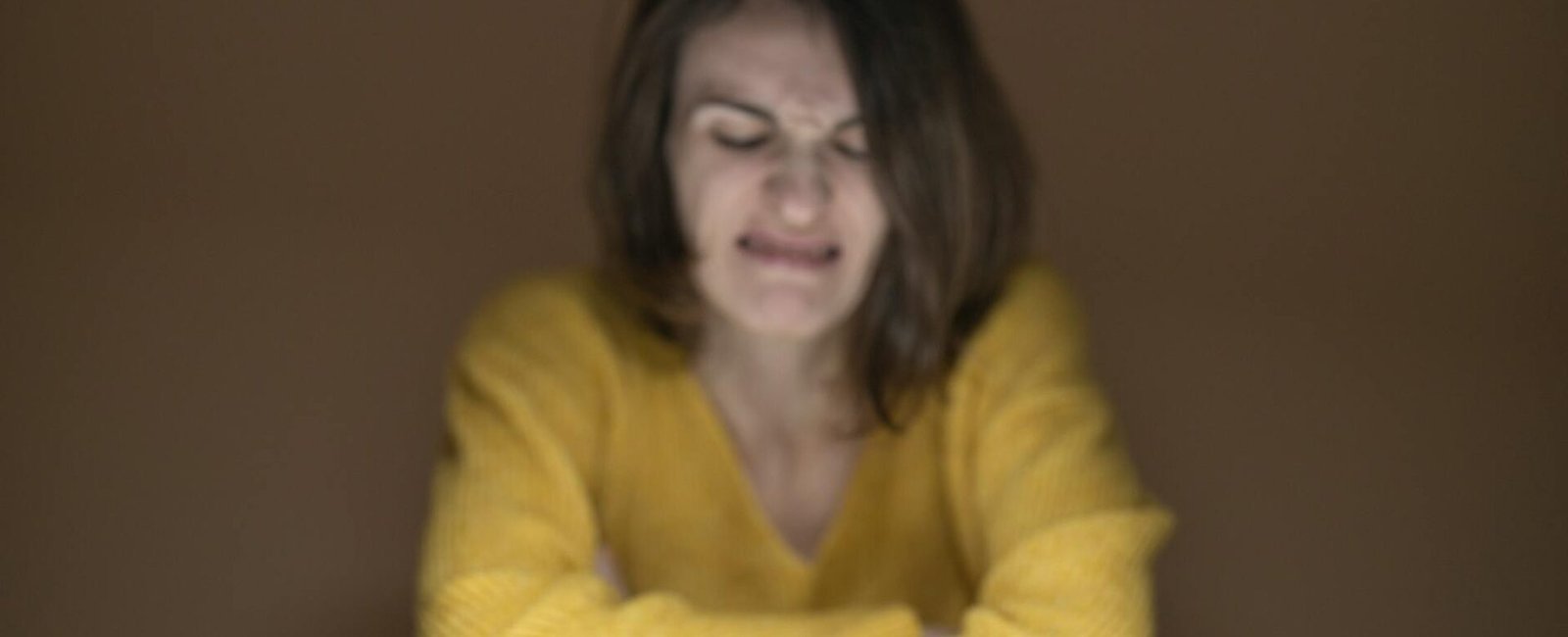 woman disgusted looking at the apple